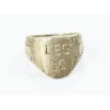 A large gentleman's white metal archers style ring, inscribed 'LEG X'