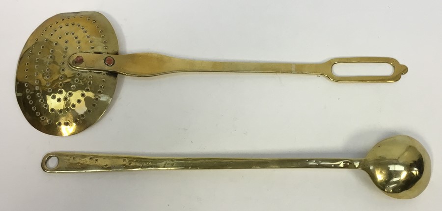 An 18th century brass dairy skimmer, two copper rivers secure the handle to the pan, L.43 cms ( - Image 4 of 4