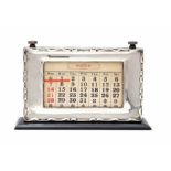 A George V silver mounted desk calendar, with articulated date adjust on a polished wooden stand, by