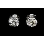 A pair of diamond solitaire 18ct white gold stud earrings, two cushion-shaped old-cut diamonds