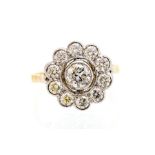 A diamond flowerhead 18ct yellow gold cluster ring, the principal brilliant-cut collet-set diamond
