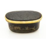A 19th century tortoiseshell oval snuff box, carved and inlaid with hunting scenes, approx 8cm long