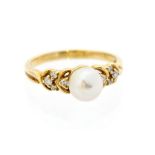 A pearl and diamond 9ct gold ring, the round cultured pearl set to the centre, measuring approx. 7.