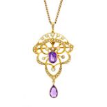 An Edwardian amethyst and seed pearl 15ct gold pendant, the open work pendant set to the centre with