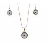 A black cultured pearl and diamond-set 14ct white gold pendant and chain, with a matching pair of