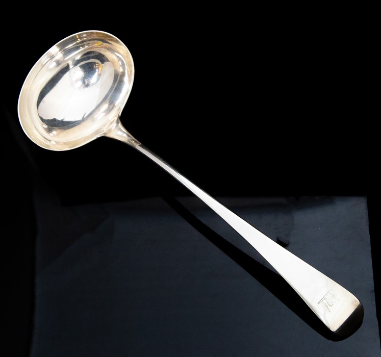 A George III Old English pattern silver soup ladle, the handle engraved with a crest, by Peter &