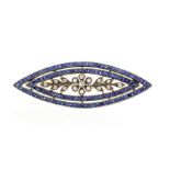 An Edwardian sapphire and diamond navette brooch, the centre set with round old-cut diamonds in a