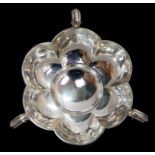 An Edwardian silver three handled tasting dish, lobed body with double C-scroll handled on stud