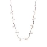 A diamond-set 18ct white gold curved waved design link choker necklace, the front links claw and