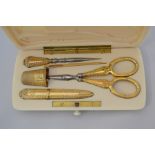 A19th Century French silver-gilt necessaire, the plain ivory fitted case scissors, pointed tool,