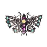 A gem-set butterfly brooch, the body set with graduated spinels, with a round opal set to the top,