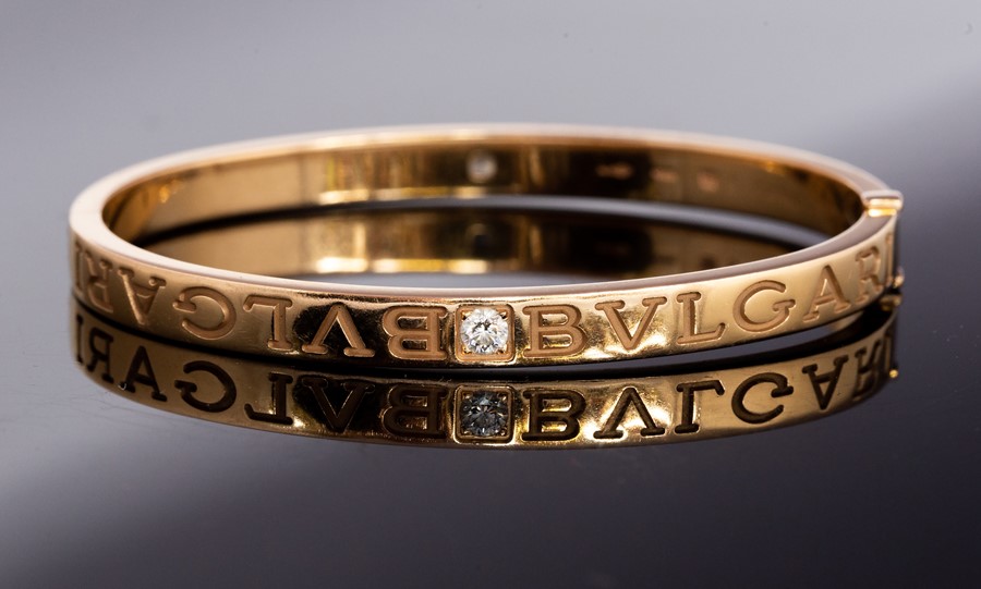 Bvlgari - A Bvlgari diamond two-stone set 18ct yellow gold hinged bangle, two round brilliant cut - Image 2 of 3