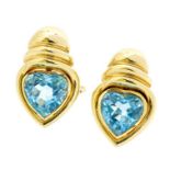 A pair of blue topaz and 18ct gold earrings, the sky blue heart shaped faceted  blue topaz measuring