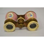 A pair of late 19th Century French gilt metal and enamel opera glasses, the pompadour pink ground