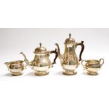 A Georgian style matched four piece silver tea and coffee service, plain bodies on circular feet
