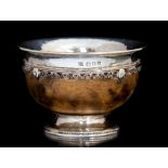 Omar Ramsden; A George V Arts and Crafts Sterling silver mounted miniature mazer bowl, London