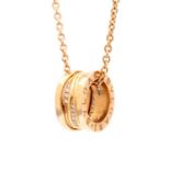 Bvlgari -  A Bvlgari diamond set rose gold B. Zero 1 coiled ring pendant and Bulgari chain, the