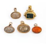 Five 19th century yellow metal and hardstone seal fobs, one inscribed 'MB' probably Michael