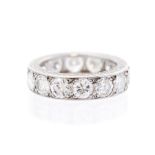 A diamond full set eternity platinum band ring, fourteen round brilliant-cut diamonds flush-grain