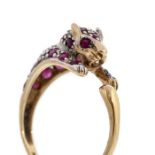 A Panther 9ct gold and ruby set ring, grain set with round stones, panther height approx. 7mm,