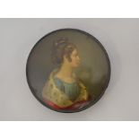 A 19th Century black lacquered circular box and cover, the cover painted with a portrait of Lady