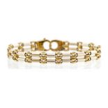 A 9ct gold two-tone fancy link bracelet, comprising white gold  double bar links with alternate gold