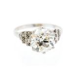 A diamond and 18ct white gold solitaire ring, the old European-cut approx 3.4 carats, assessed