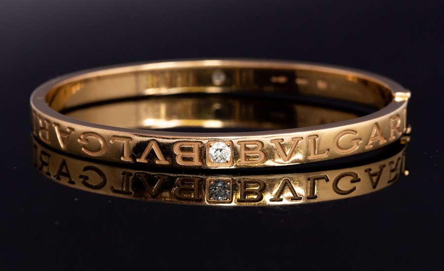 Bvlgari - A Bvlgari diamond two-stone set 18ct yellow gold hinged bangle, two round brilliant cut - Image 3 of 3