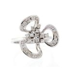 A diamond stylised three-leaf clover cluster ring, small round brilliant and round eight-cut