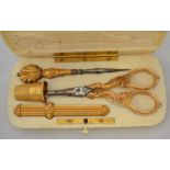 A 19th Century French gold necessaire, the plain ivory fitted case scissors, pointed tool, etui and