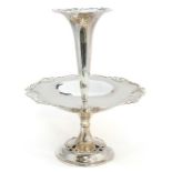 An Edwardian silver table centrepiece, circular body with scrolling openwork border surmounted by