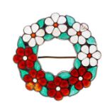 A modernist silver and enamel brooch, open circular design with floral decoration, one side with red