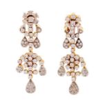A pair of diamond set 18ct yellow gold drop earrings, comprising floral set clusters and pear shaped