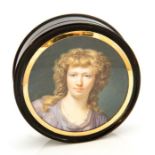 A 19th century circular tortoiseshell snuff box, the cover set with a portrait miniature of a
