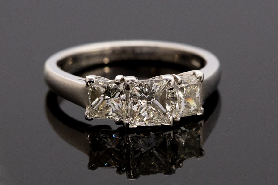 A diamond three stone platinum ring, three princess-cut diamonds total weight approx 1.75carats, - Image 2 of 2