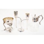 An early 21st century hammered metal champagne flutes on stand together with a plated glass wine jug