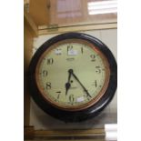 Smiths, Enfield, London; An early 20th century, metal, round wall clock, in need of a clean,