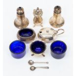 Assorted silver cruets including mustard pots plus two extra blue glass inners, combined silver