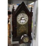 A Continental made, mantle clock, in the ecclesiastical style, bearing Roman numerals; together with