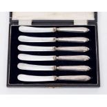A boxed set of filled handle butterknives, Sheffield 1922, retailed by Fattorims
