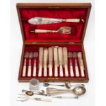 A cased set of fish serving cutlery with skewers, ferrules dated Sheffield 1900 and 1905, twisted
