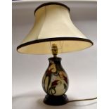 A 20th Century Moorcroft table lamp, with shade, height to top of lamp, approx. 29cm, with shade,