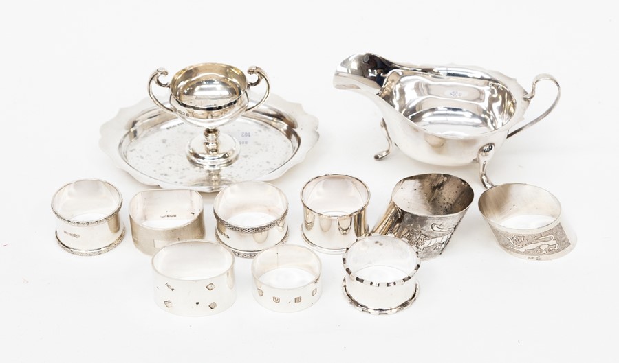 A group of silver items including silver napkins rings and a Sheffield silver sauce boat, 1966,