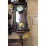 A Vienna Regulator, mahogany framed, complete with brass weights and pendulum, Roman numerals,