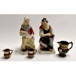 A pair of 19th Century Staffordshire figures: 'The Cobbler' and 'His Wife'; together with three