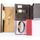 A 'les must de Cartier' silver gilt Tank wristwatch in box with paperwork together with a Gucci gilt