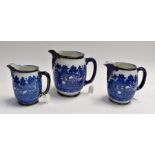 A Royal Doulton Burslem Willow Pattern, set of three jugs, various sizes, height of largest jug,