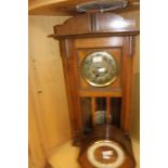 A mid-20th century wall clock, complete with pendulum; together with a 1930's mantle clock, Arabic