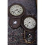 Seth Thomas, USA; A pair of wall clocks, both bearing Roman numerals, as seen, damages to both, in