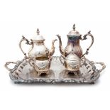 An FB Rogers four piece tea set, EP brass standing on an ornate twin handle plated tray